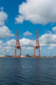 two harbor cranes in amsterdam harbor