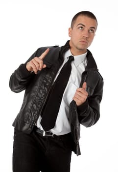 Studio photo of trendy young man looking and pointing upward on white background.