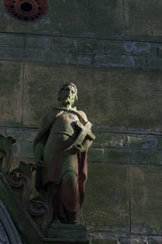 Figure with a cross in his hand