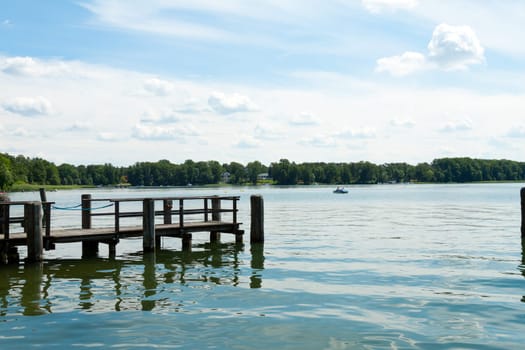 Footbridge juts out into the blue Scharmützelsee