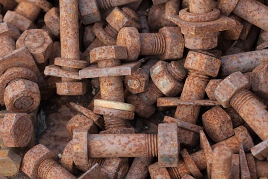 Rusty bolts with nuts in a box
