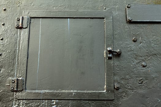 Steel hatch in a steel wall on a locomotive