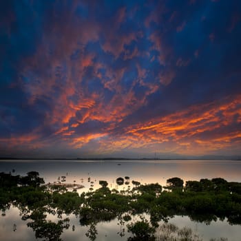 morning lake landscape with sunrise over mountains