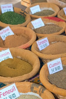 Various kinds of spices prepared to sell at a farmer's market.