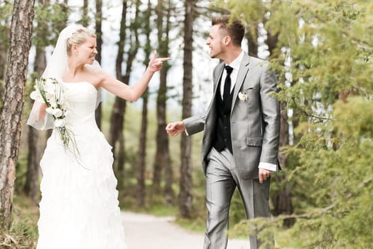 Bride and groom in the forest arguing violently