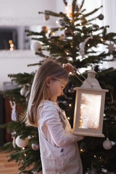 Girl holding a lantern with lights