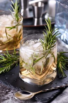 The Rosemary Vodka cocktail consists of maple syrup with a small amount of salt, rosemary, crushed ice and vodka. Vodka can be replaced with other alcohol - tequila, white rum, gin.  