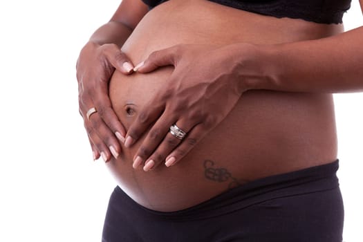Young beautiful pregnant indian woman touching her belly