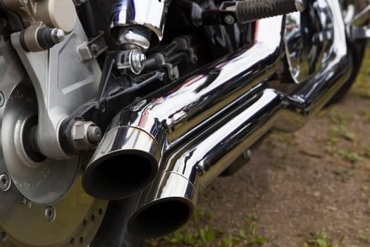 Bike chromed double pipes are reflecting sun light
