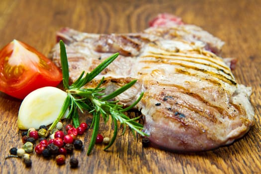 Grilled meat on wooden table