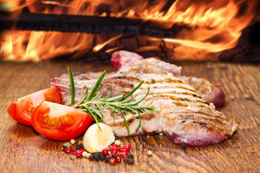 Grilled meat on wooden table