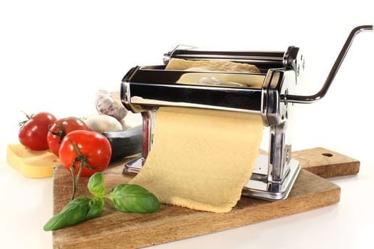 a pasta machine with homemade pasta dough