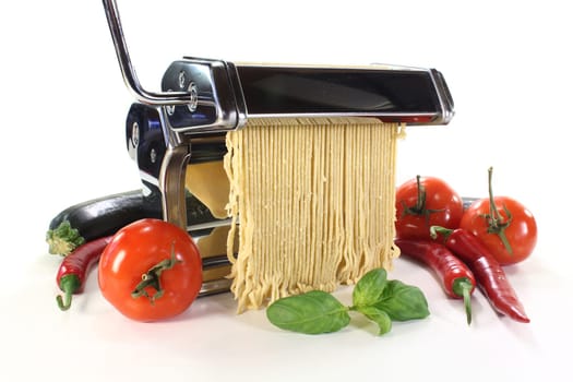 a pasta machine with homemade pasta dough