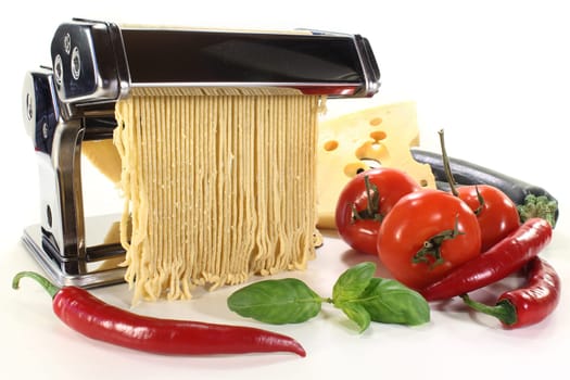 a pasta machine with homemade pasta dough