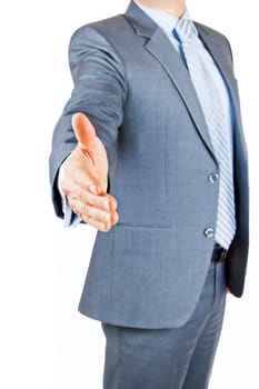 Business person extending hand to shake on greeting or deal