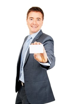 Confident young man holding blank copy space business card on isolated background
