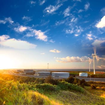 A road and windmills during sunset, made with a wide angle lens