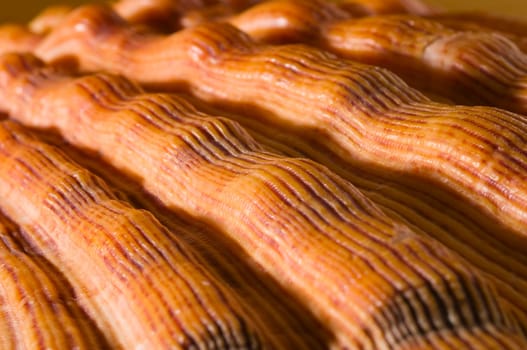 Detail close-up of an orange-colored grooved mixing bowl