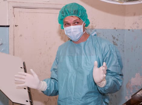 Happy surgeon widing hands before coming difficult surgery