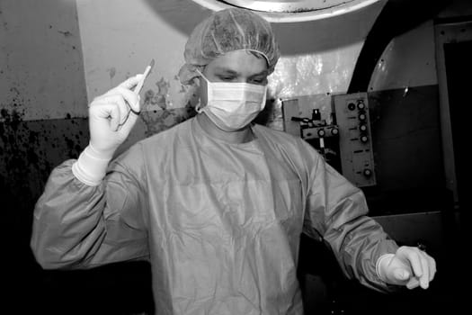 Shaded surgeon prepare cut before coming difficult surgery