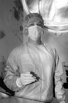Shaded surgeon standing calmy before coming difficult surgery