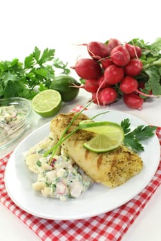 Potato salad with fresh herbs and hake fillet