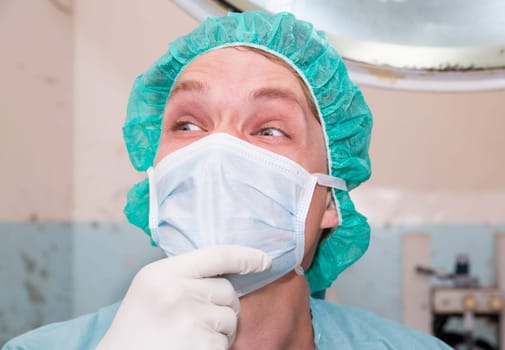 Surgeon is laughting about some joke before surgery