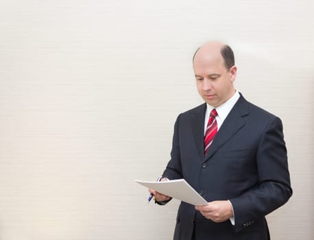 Business man reading a document.