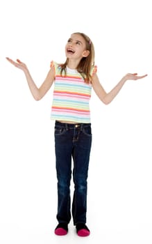Studio photo of little girl standing with arms extended as though juggling, on white background.