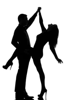 one caucasian couple man and woman dancing rock in studio silhouette isolated on white background