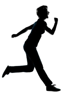 one caucasian young teenager silhouette boy or girl happy running full length in studio cut out isolated on white background