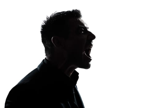 one caucasian man portrait silhouette profile screaming angry in studio isolated white background