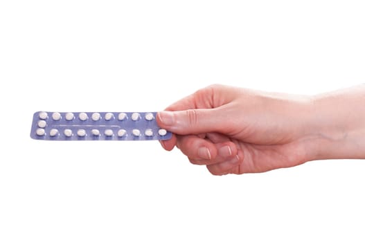 White isolated female hand holding a pack of birth control pills