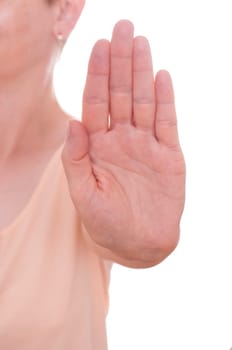 Woman holding hand forward as a stop sign