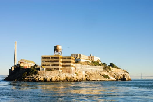 Alcatraz island prison in San Francisco Bay at sunset
