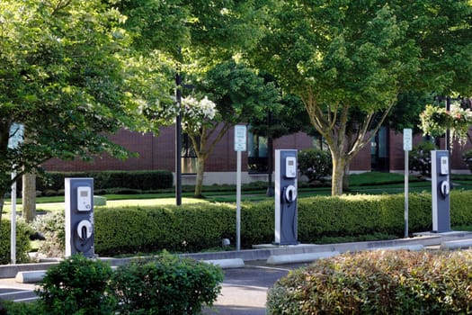 BEAVERTON, OREGON - MAY 25: Three electric vehicle charging stations located across from the city library on May 25, 2012 in Beaverton, Oregon. Energy is partially supplied by photovoltaic panels located nearby.