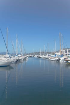Sailboats and yachts in a quiet harbor ocean marina (France)