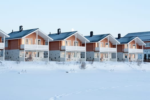 Lodges in snow, sundown, moon, winter, sky