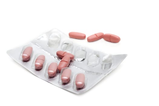 Capsules with vitamin packed insulated on white background