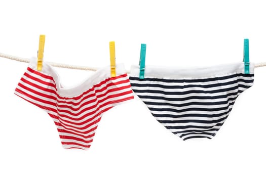 Colour undershorts hung on linen rope with clothes-peg