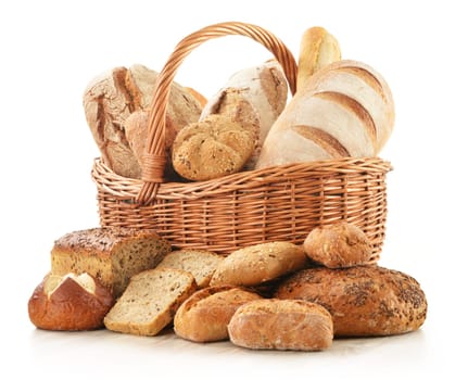 Composition with bread and rolls in wicker basket isolated on white