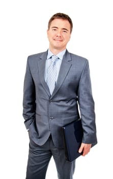 Relaxed business man standing with laptop in hand