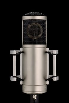 Elegant studio microphone on holder isolated on black background