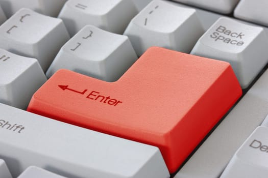 Red enter button on the computer keyboard