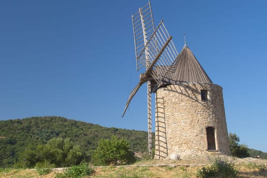 Ancient stone windmill (near village Grimaud, Provence, France)