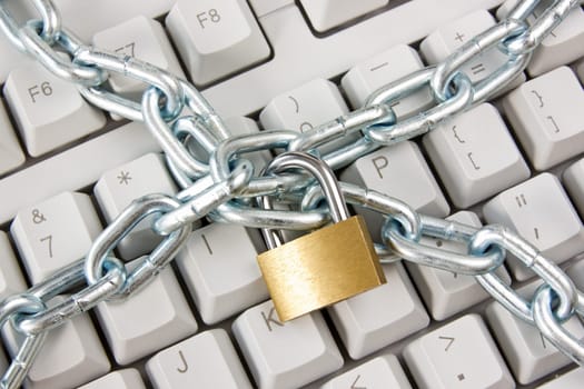 computer  keyboard secured with chain and padlock