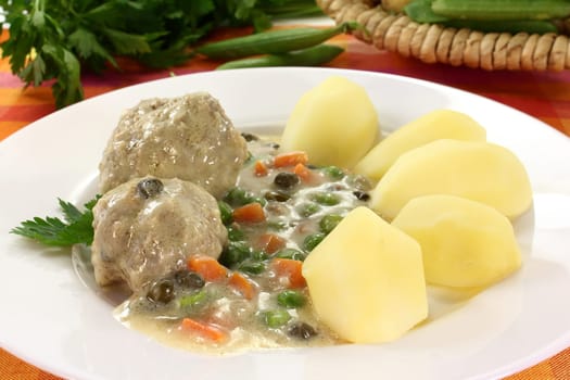 Königsberger meatballs with capers,peas and carrots