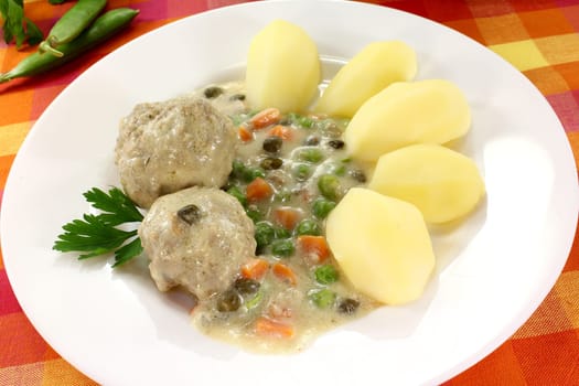 Königsberger meatballs with capers,peas and carrots