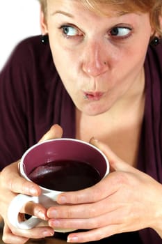 girl is drinking from a cup