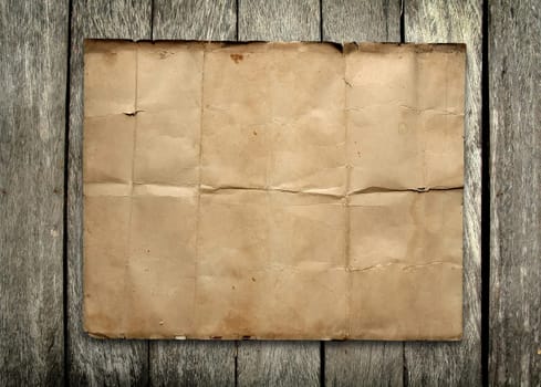 old paper on wood background